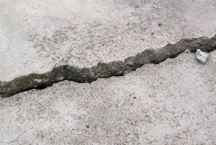cracked and sunken section of sidewalk
