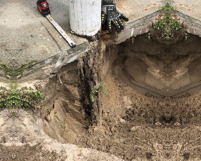 Coastal piles are rotted away under concrete slab