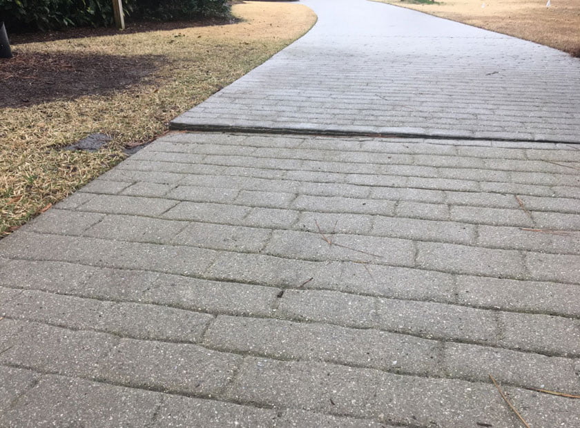 sunken sidewalk section that needs Polyurethane Foam repair