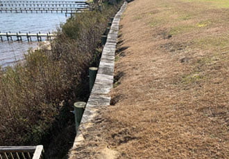 Damaged Seawall with soil erosion