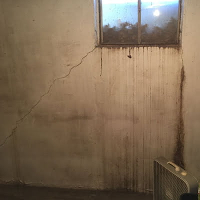 Cracked concrete basement wall